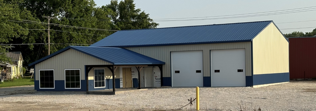 Rodgers Heating and Cooling new location building with blue roof